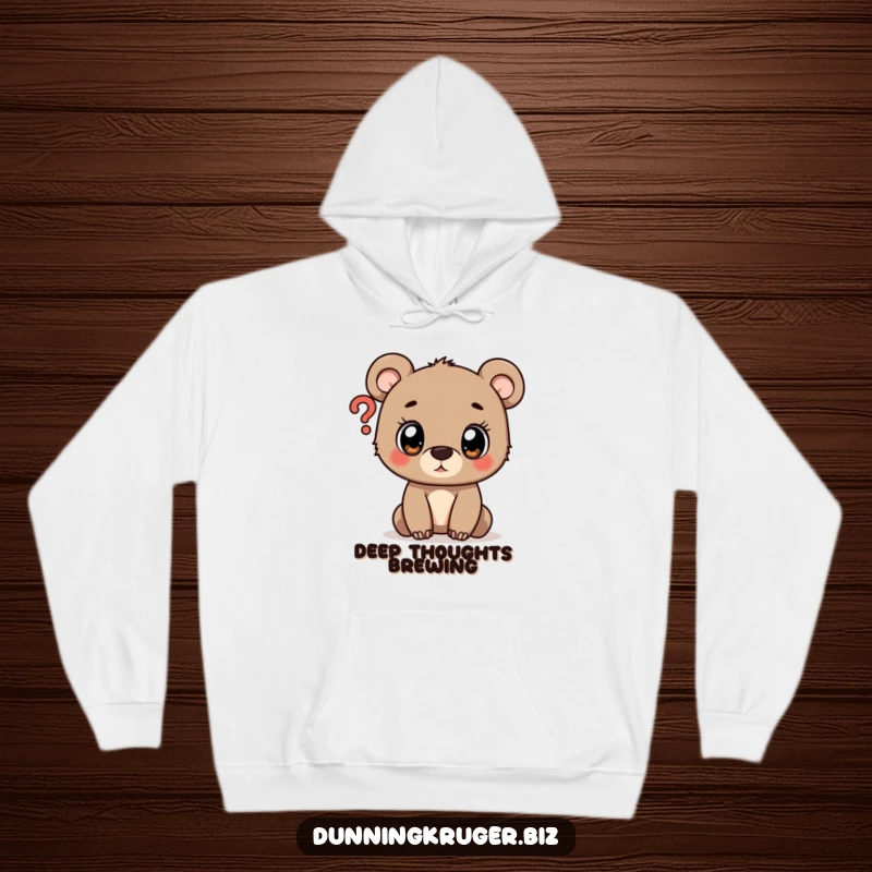 Funny comfy hoodie showcasing a wide-eyed bear cub curiously examining a question mark, perfect for cozy contemplation.