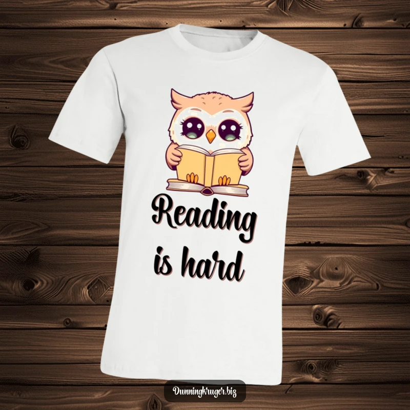 Funny t-shirt featuring a giggling owl with dramatically wide eyes, blankly staring at a simple book, conveying humorous confusion.